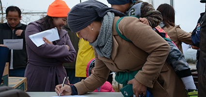 People filling out forms