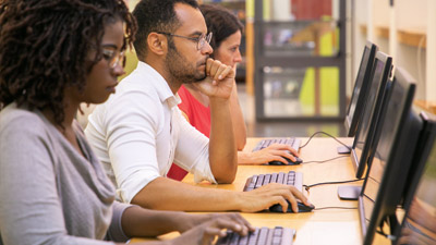people taking an exam on computers